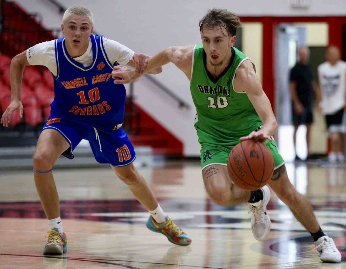 Harlan senior guard Dylan Cox worked around a Campbell County, Tenn., defender in summer scrimmage action Tuesday at Whitley County.