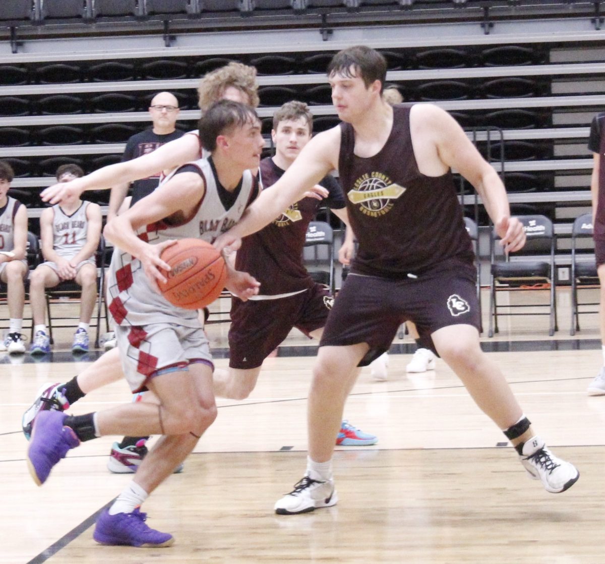 Harlan County's Brennan Blevins worked to the basket in scrimmage action Monday against Leslie County. Blevins led the Bears in rebounds in a 70-29 win.