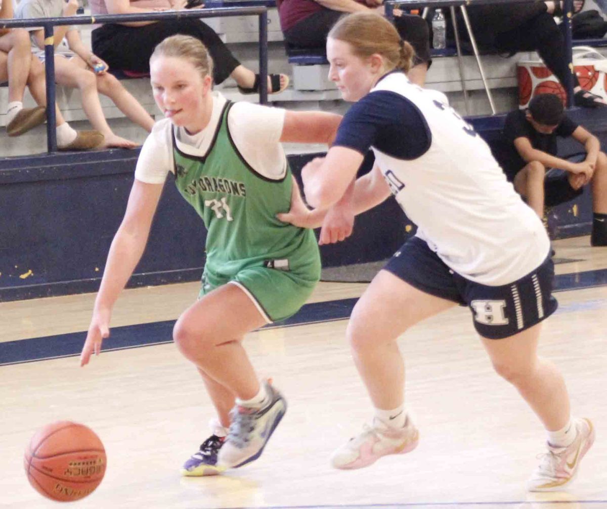 Harlan senior Cheyenne Rhymer worked against a Hazard defender in scrimmage action Monday at Memorial Gymnasium. The Lady Dragons were tied 25-25 at halftime before Hazard pulled away for a 61-37 victory. The Lady dragons fell 45-29 to Owsley County in an earlier scrimmage.
