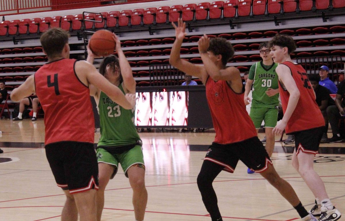 Harlan sophomore forward Eli Noe worked inside for a shot in summer action Friday against Whitley County at South Laurel. The Dragons led early before Whitley Red rallied to win 35-29. The Dragons also fell to South Laurel by a final of 61-45. Harlan split two games at South on Thursday, defeating Berea before falling 61-53 to Whitley Black. The Dragons are 6-6 on the summer and return to action Monday through Wednesday at UVA-Wise.