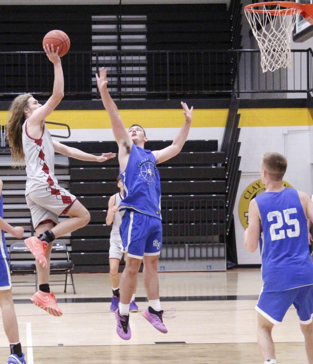 Harlan County senior guard Reggie Cottrell sailed to the basket for two of his 16 points in an 80-36 win over Betsy Layne at Clay County High School.
