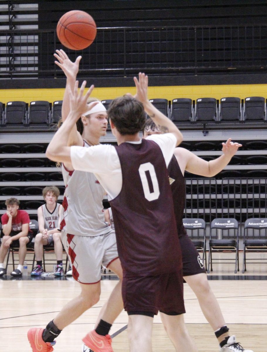 Harlan County guard Reggie Cottrell dropped off a pass on a fast. break in scrimmage action Monday. Cottrell scored 21 points in the Bears' 70-29 victory.