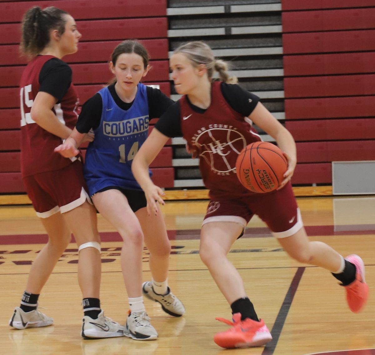 Harlan County eighth-grade guard Taylynn Napier worked against the Letcher Central defense with the help of a pick from Raegan Landa in action from the Leslie County Team Camp. Harlan County won four of four junior varsity scrimmages and split four varsity scrimmages during the week.