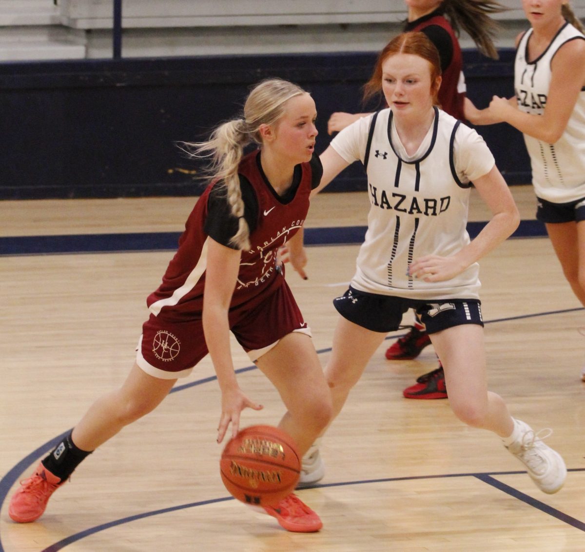 Harlan County eighth-grader Taylynn Napier worked around a Hazard defender in summer scrimmage action. Napier helped lead the HCHS junior varsity squad to an 11-0 mark in the summer.