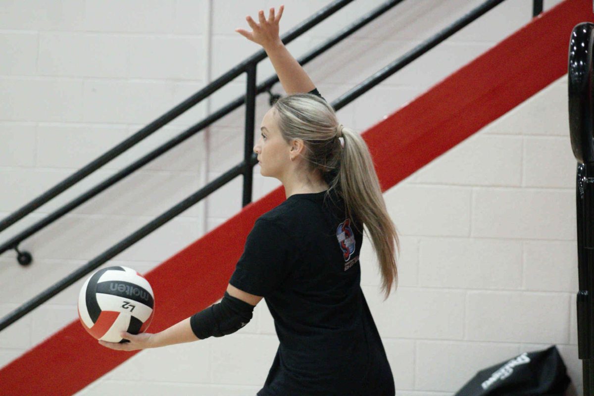 Harlan County senior Savannah Hill prepared to serve in summer scrimmage action Tuesday at Whitley County. The Lady Bears defeated Leslie County and Southwestern, split with Whitley County and lost to Wayne County.
