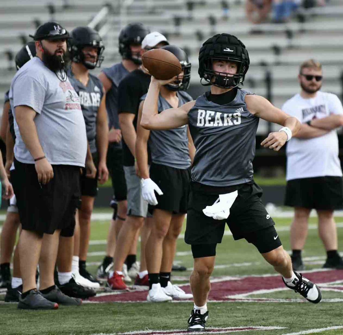Harlan County quarterback Brayden Morris rolled out for a pass in scrimmage action Tuesday against Pineville at Coal Miners Memorial Stadium.