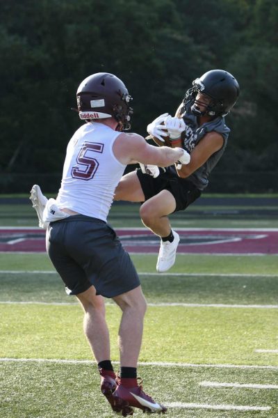 Harlan County junior receiver Kayden Adams went up for a catch in seven-on-seven scrimmage action Tuesday against Pineville.