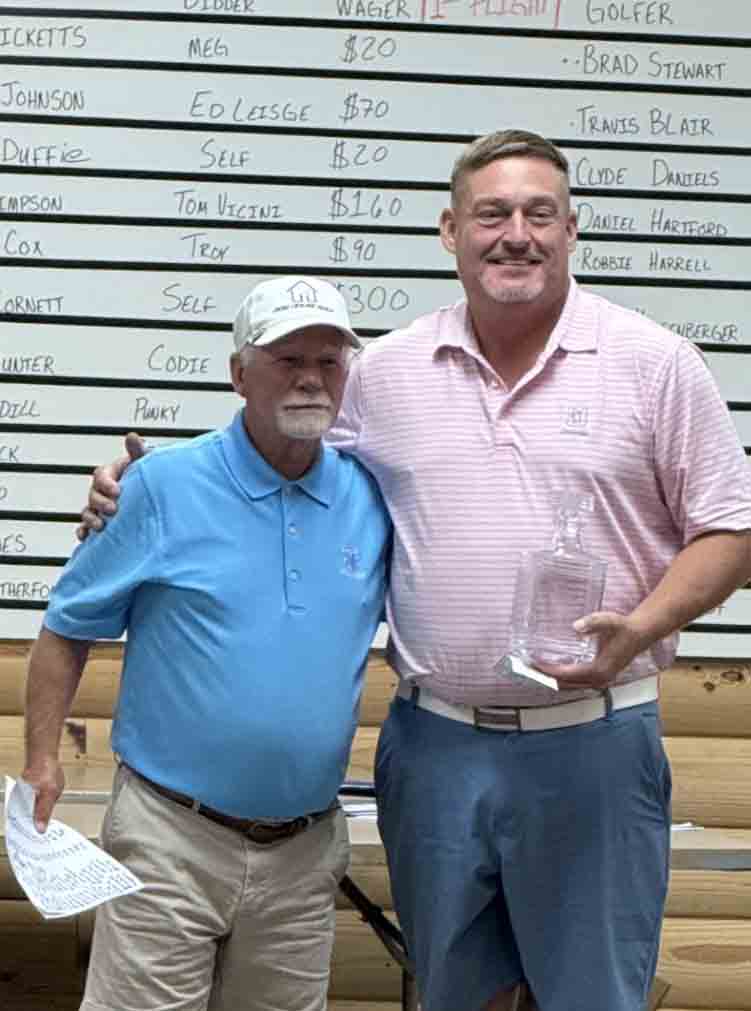 Pete Cornett Jr. (right) is pictured with Rainbo Johnson after winning his third Lynch Invitational Tournament title on Sunday.