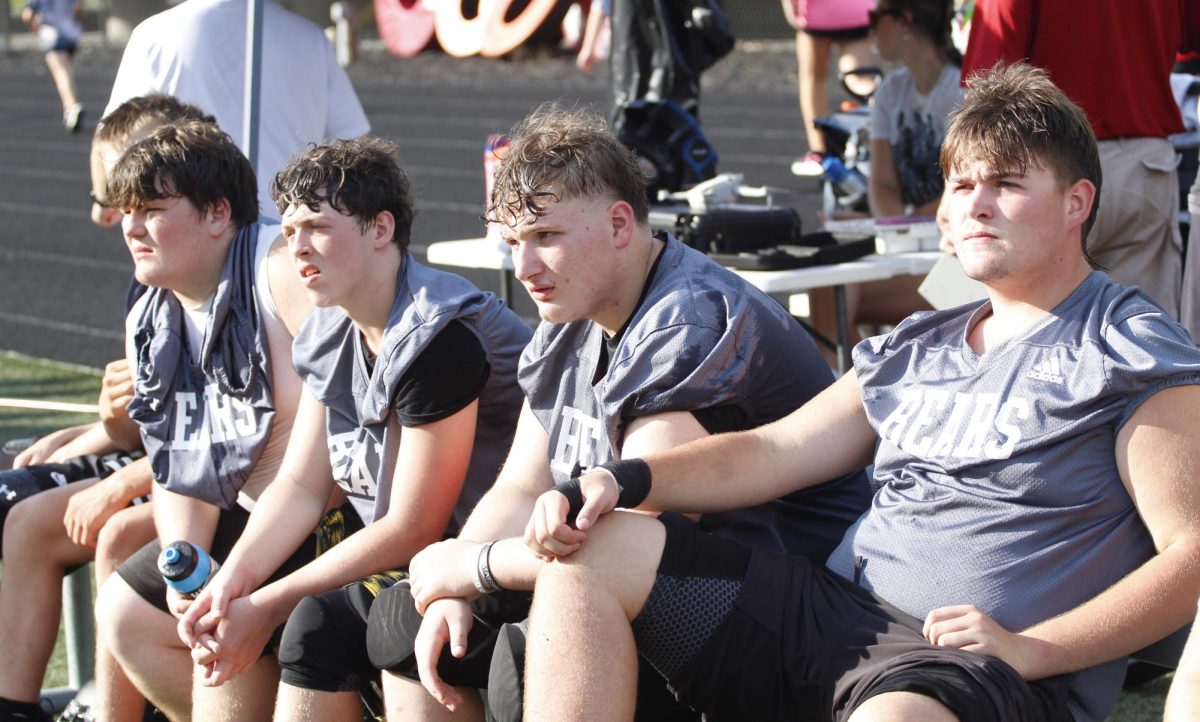 Harlan County linemen watched the action Tuesday during a scrimmage against Pineville.