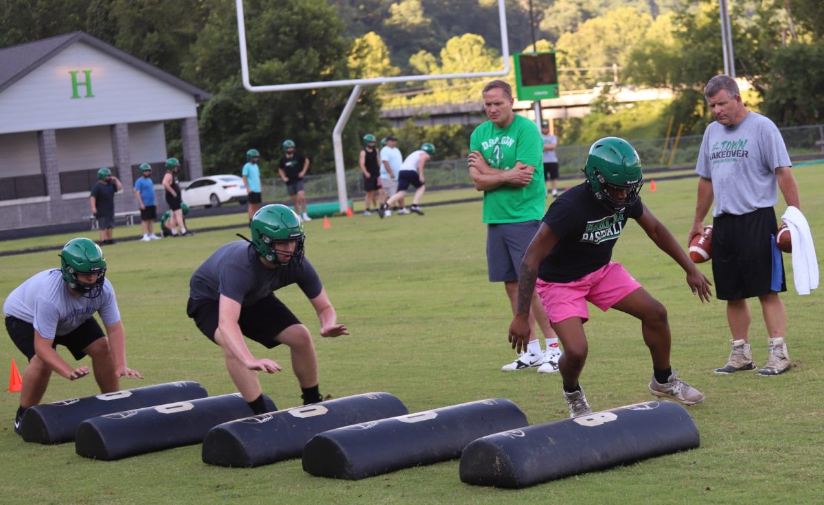 Several Harlan Green Dragons worked through a drill during a practice session Monday. The Dragons open their season Aug. 22 at Knott Central.