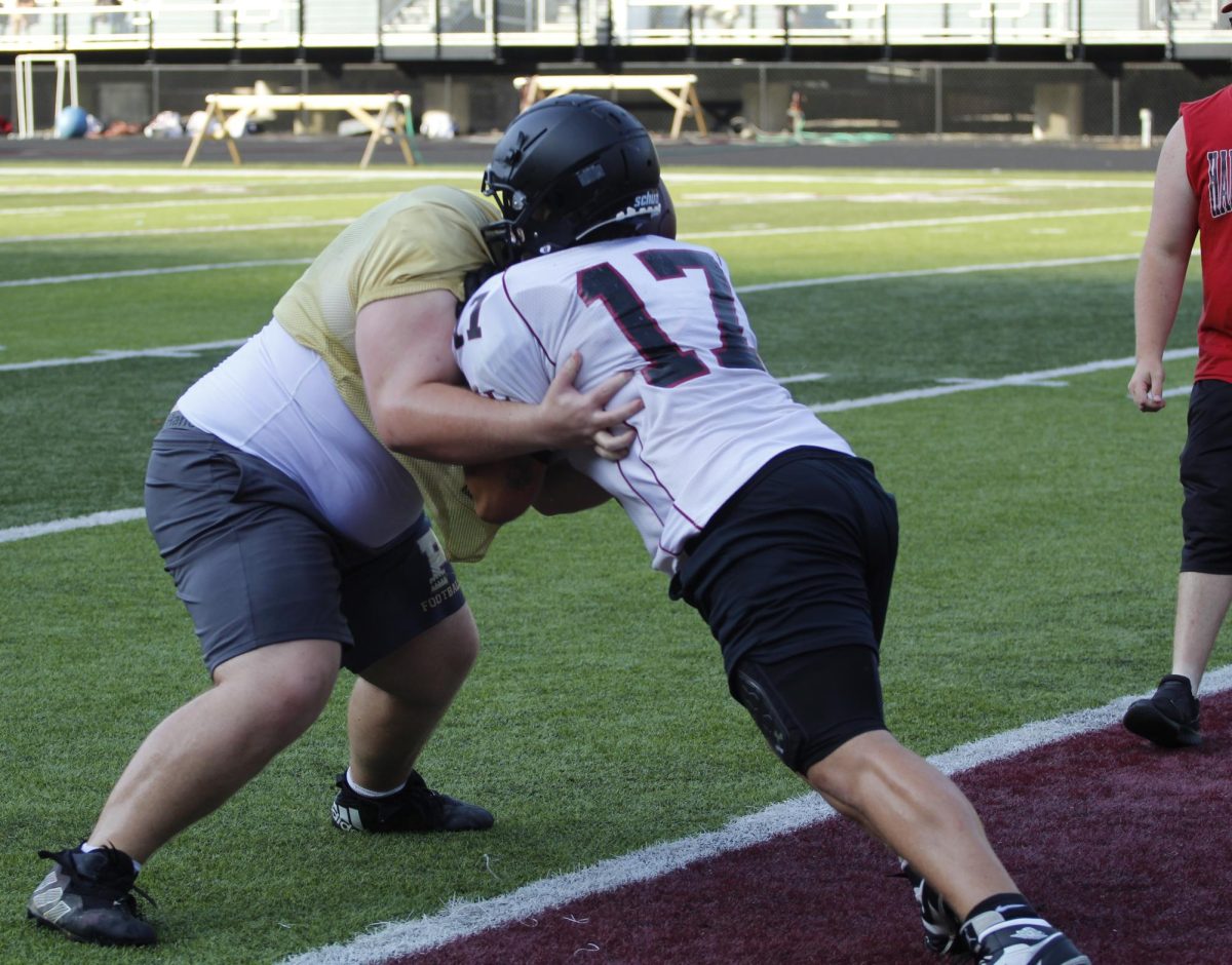 Harlan County lineman Cooper Blevins (17) worked against a Pineville lineman in scrimmage action.