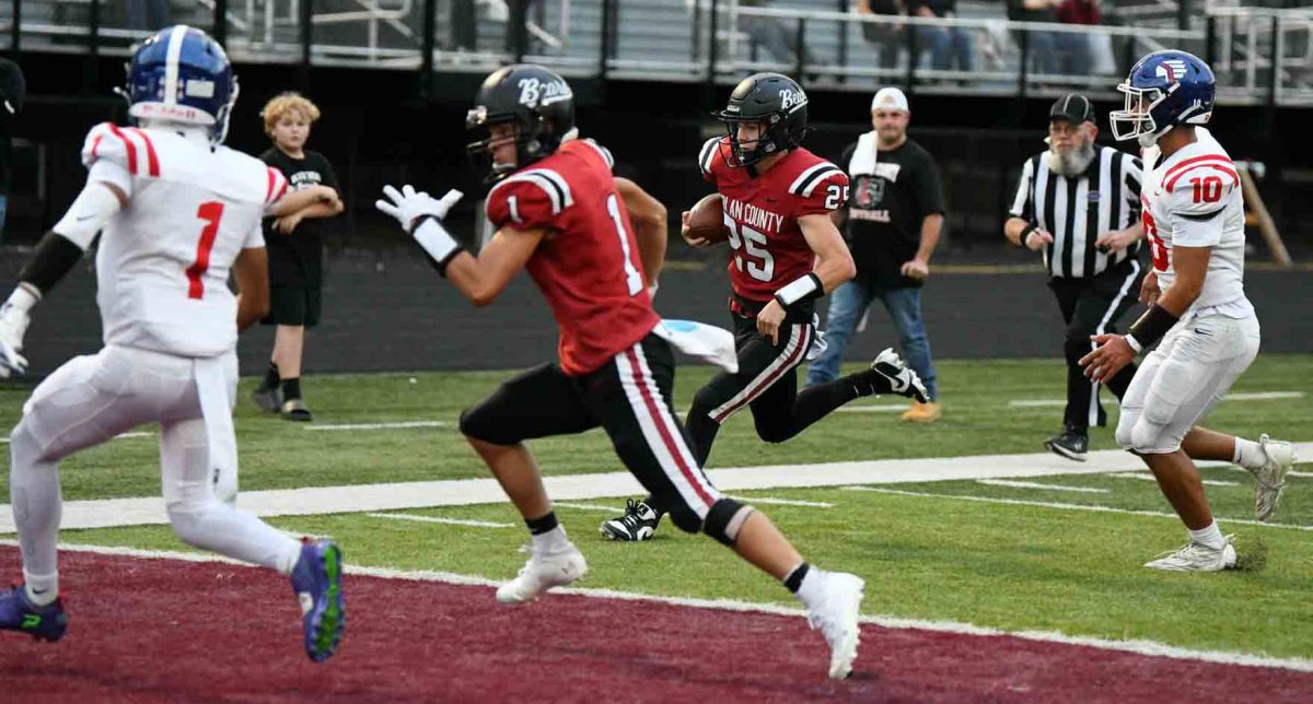 Harlan County quarterback Brayden Morris headed toward the end zone for one of his three rushing touchdowns in the Black Bears' 35-0 victory over visiting Eminence.