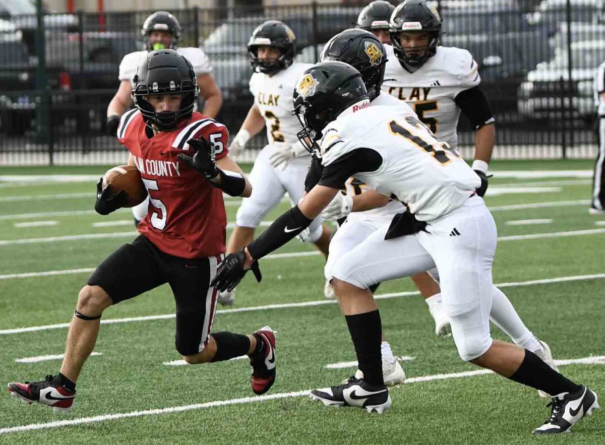 Harlan County senior running back/receiver Gage Bailey worked around a Clay County defender in Saturday's Cumberland Falls Pigskin Classic. Bailey had a touchdown and interception in the Bears' 21-0 victory.