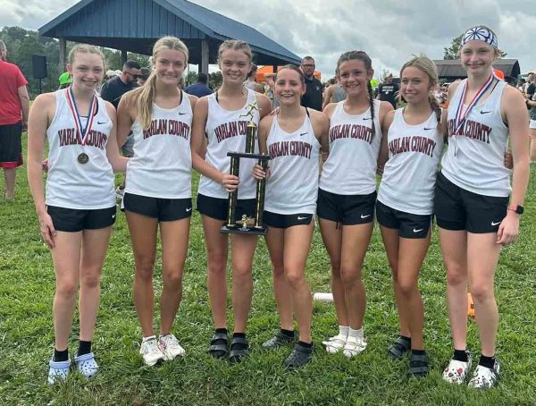 The Harlan County girls placed second Saturday in the season-opening meet at Lynn Camp. Team members include, from left, Kiera Roberts, Lauren Lewis, Preslee Hensley, Suzy Mumford, Sienna Banks, Julionna Johnson and Gracie Roberts.
