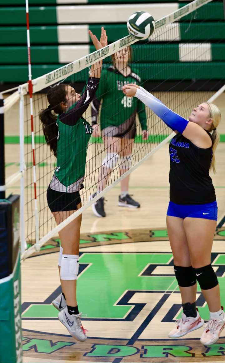 Harlan freshman Clarissa Yost went to the net for a block in the Lady Dragons season-opening match against June Buchanan. The visiting Lady Crusaders won in three sets.