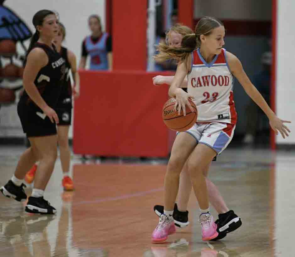 Cawood guard Addy Cochran worked around a Cumberland defender Saturday in county tournament action. Cochran scored 11 points in the Lady Comets' 29-12 victory.