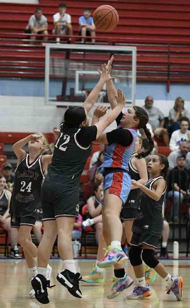 James A. Cawood's Khloe Daniels worked inside for a shot during the Trojanettes' 35-2 win Saturday in the fifth- and sixth-grade county tournament.