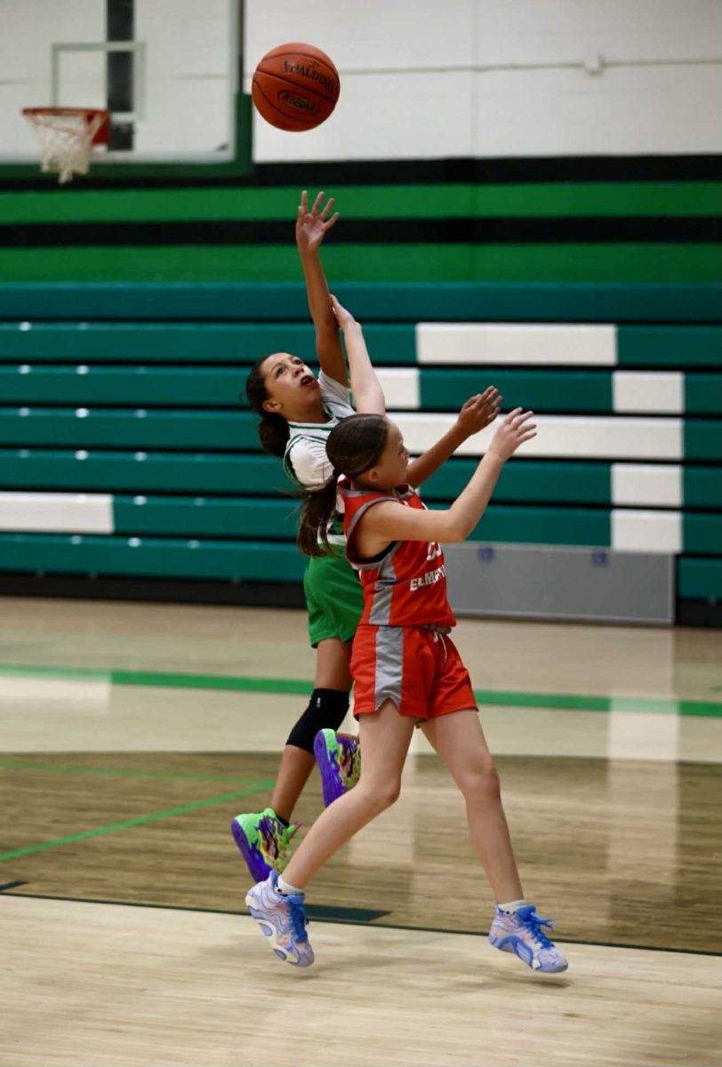 Harlan's Addison Sanford went up for a shot in fifth- and sixth-grade basketball action Thursday against Corbin. 