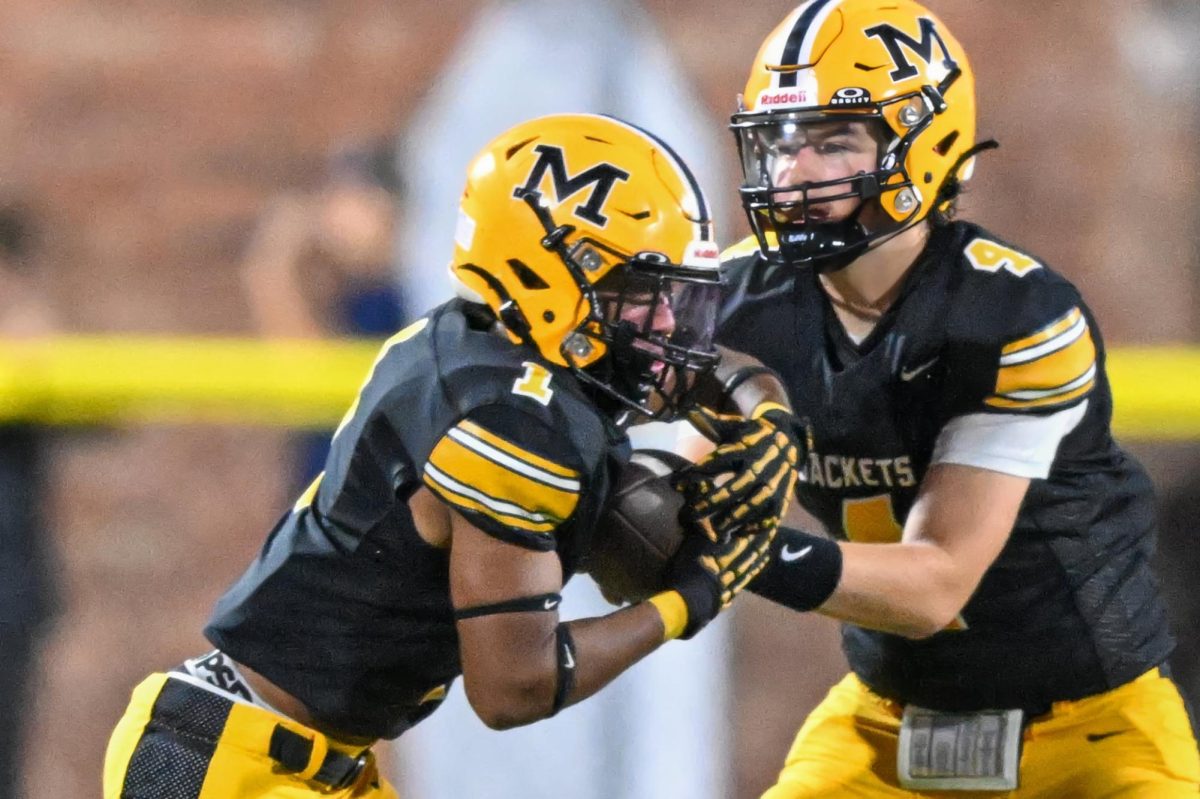 Middlesboro quarterback Deakon Partin handed the ball off to running back Caden Lawson in Friday's game. Partin passed for two touchdowns and Lawson ran for one in a 46-14 victory.
