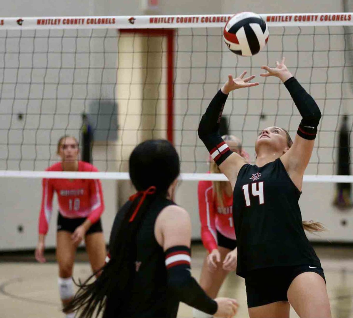 Harlan County senior Savannah Hill set up a return for a teammate in 13th Region volleyback action Tuesday at Whitley County. The Lady Colonels, the regional favorite, won in three sets.