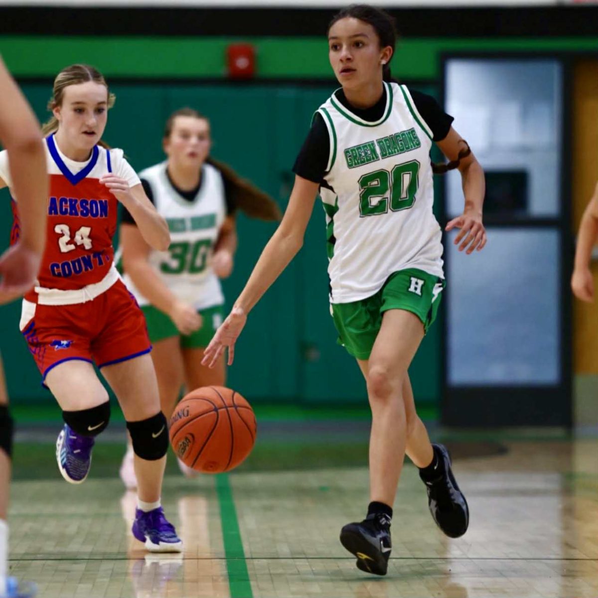 Harlan's Jerrah Phillips led a fast break in middle school basketball action Monday. Jackson County claimed a 37-18 win.