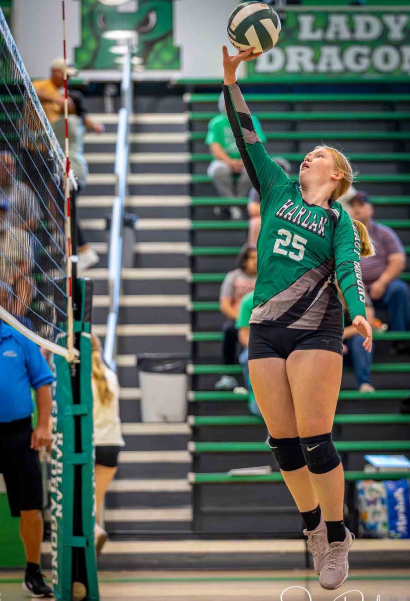 Harlan's Shealyn Brackett went up for a return during action earlier this season. The Lady Dragons recorded a four-set win Tuesday over Lynn Camp.