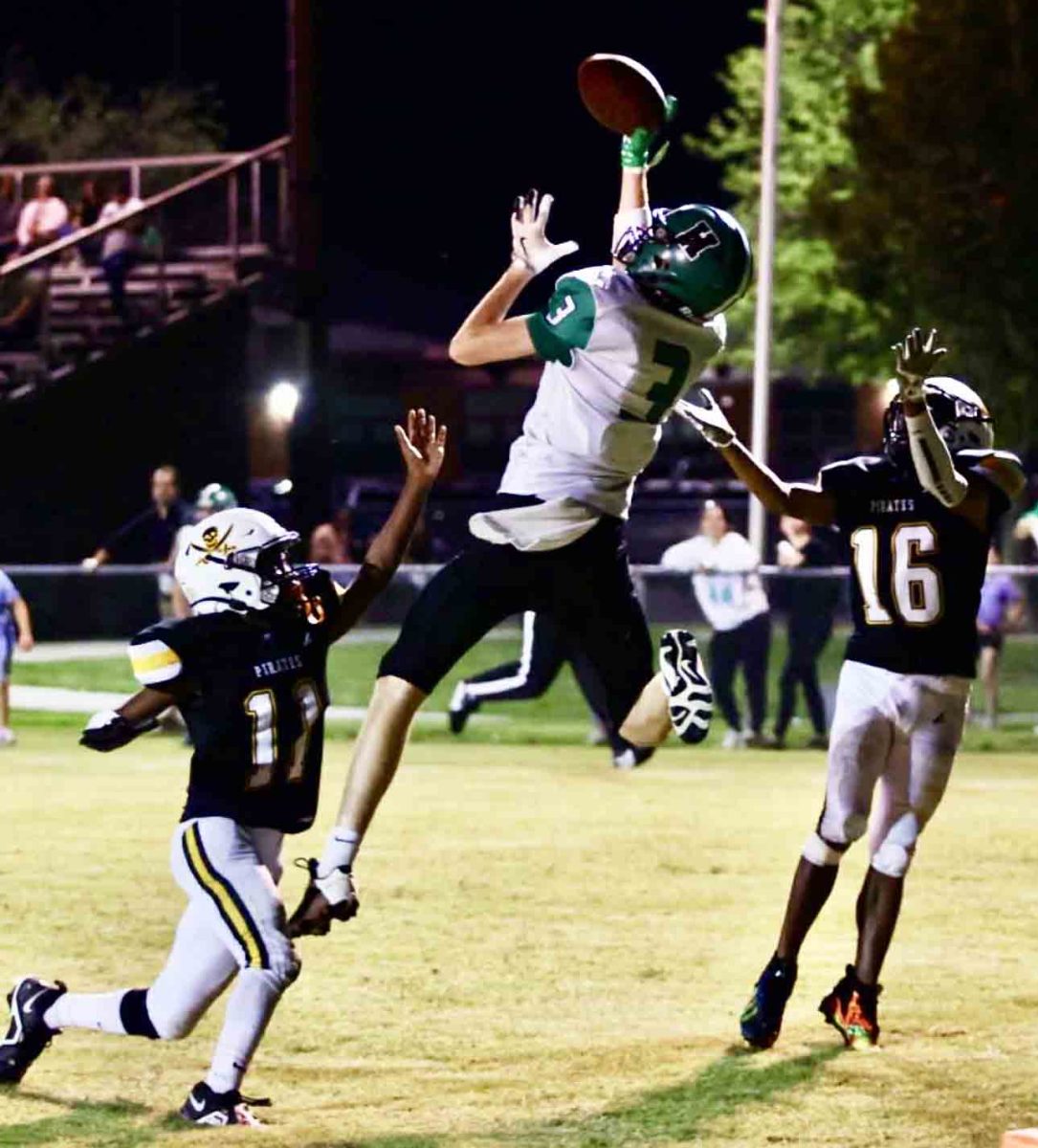 Harlan sophomore receiver Izack Saylor went up for a touchdown catch Friday on a pass from Elijah Caudill in the Dragons' 18-14 win at Berea.