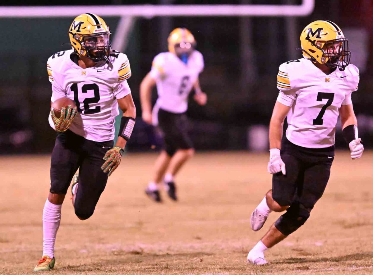 Middlesboro senior defensive back Amari Houston followed Jacob Tinnell in a 70-yard interception return for a touchdown on Friday during the Jackets' 58-0 win at Harlan for the 700th victory in program history.