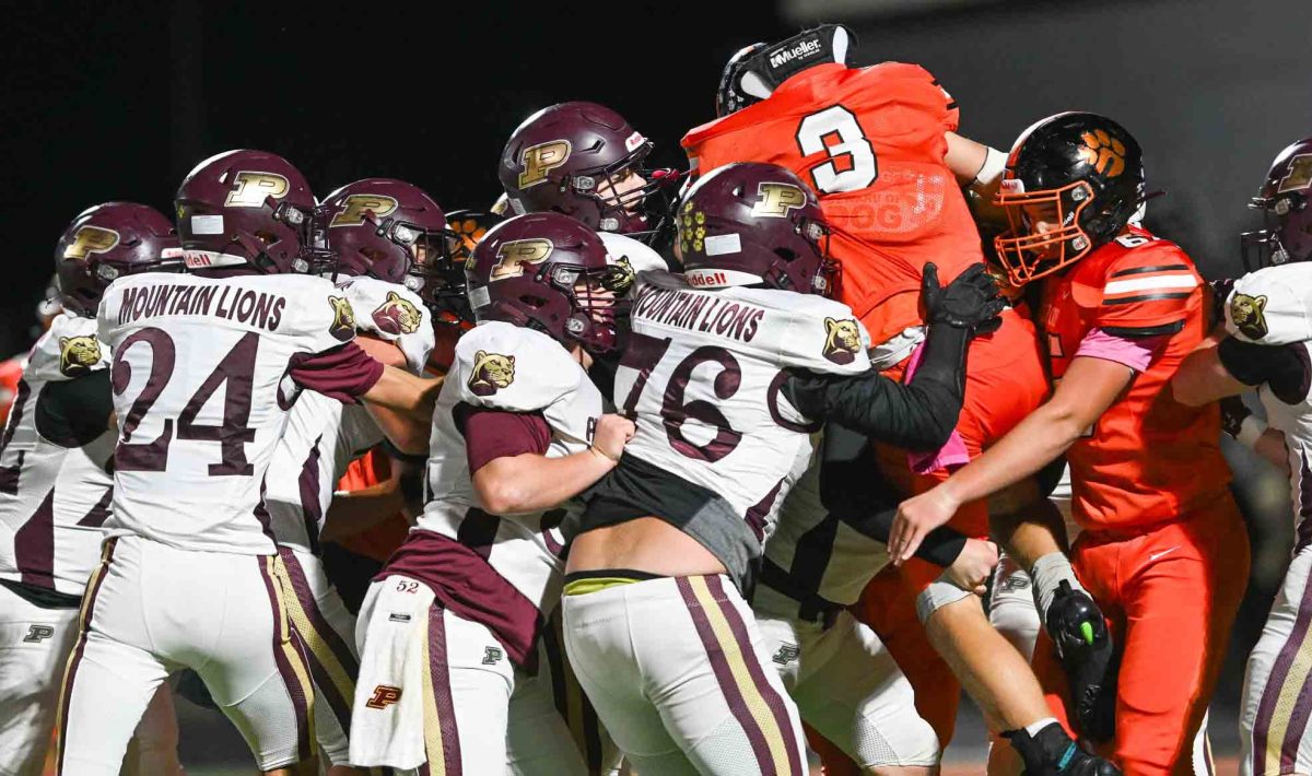 Lynn Camp running back D.J. Wren was surrounded by Mountain Lions during Pineville's 16-8 win Friday.