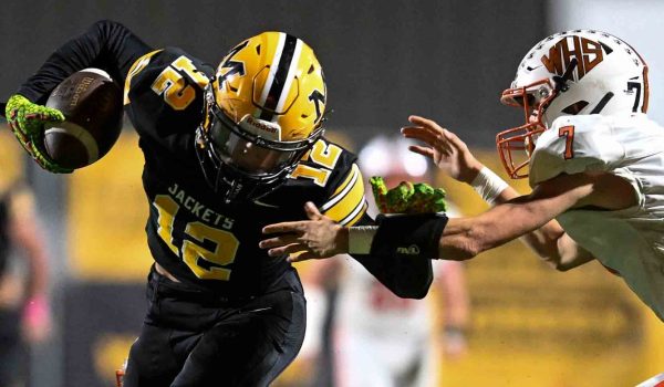 Photo by Danny Vaughn
Middlesboro receiver Amari Houston battled to break away from a Williamsburg defender in Friday's district. Houston had two touchdown receptions in Middlesbor's 22-14 victory.
