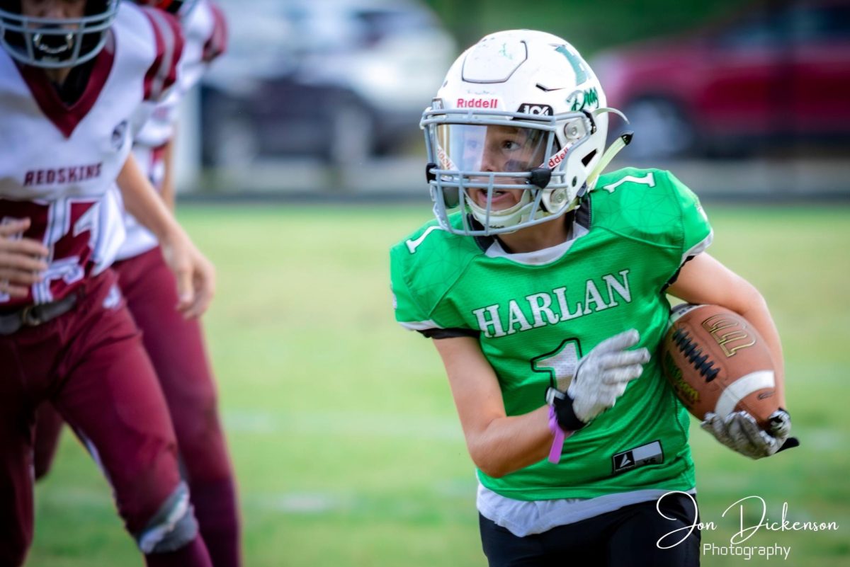 Harlan's Judah Shope, pictured in action earlier this season, ran for 145 yards and two touchdowns Thursday in the Dragons' 30-26 win at Pineville.