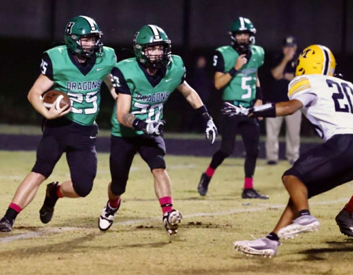Harlan running back Landon Kirby followed Eden Caudill in Friday's game against Middlesboro. The visiting Yellow Jackets rolled to a 58-0 win.