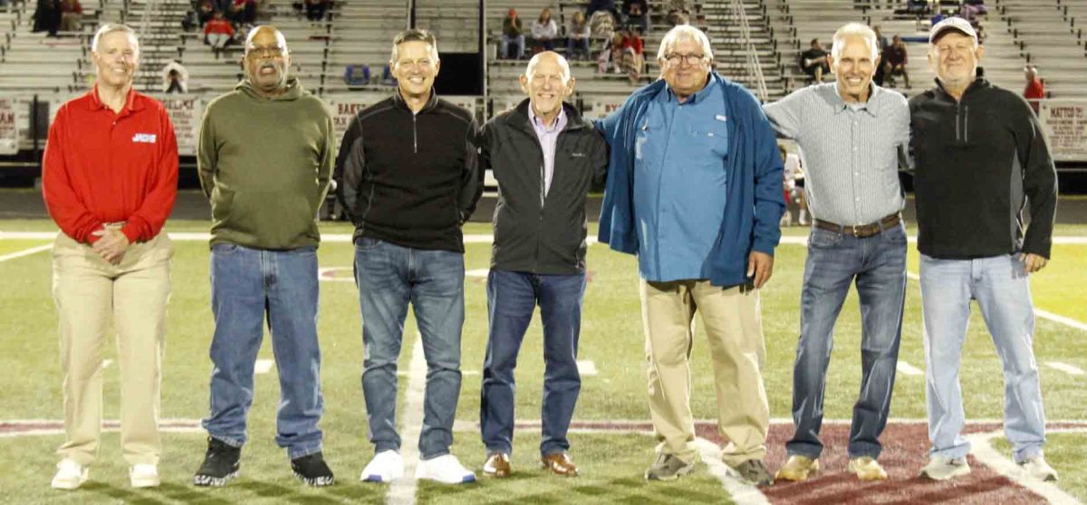 Members of Cawood's 3A regional championship team from 1975 were honored at halftime of the Perry Central-Harlan County game at Coal Miners Memorial Stadium. Team members, from left, included P.J. Collett, Gary Greer, Mike Anderson, assistant coach Johnny Ashurst, Mike Johnson, Daven Hoskins and David Burkhart.