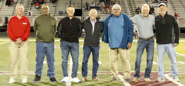 Members of Cawood's 3A regional championship team from 1975 were honored at halftime of the Perry Central-Harlan County game at Coal Miners Memorial Stadium. Team members, from left, included P.J. Collett, Gary Greer, Mike Anderson, assistant coach Johnny Ashurst, Mike Johnson, Daven Hoskins and David Burkhart.