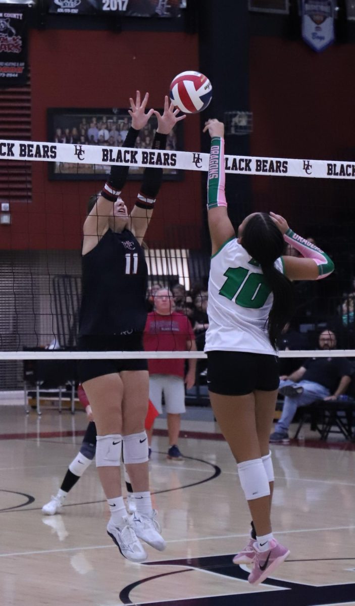 Harlan County's Kylee Hoiska and Harlan's Peyshaunce Wynn battled at the net in Thursday's district clash. The Lady Bears improved to 4-1 in district action with a 25-10, 25-5, 25-12 victory.