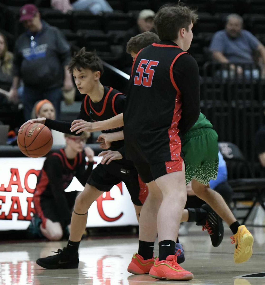 James A. Cawood's Tucker Daniels worked around a defender in action earlier this season. The Trojans won two games Saturday at Bell County.