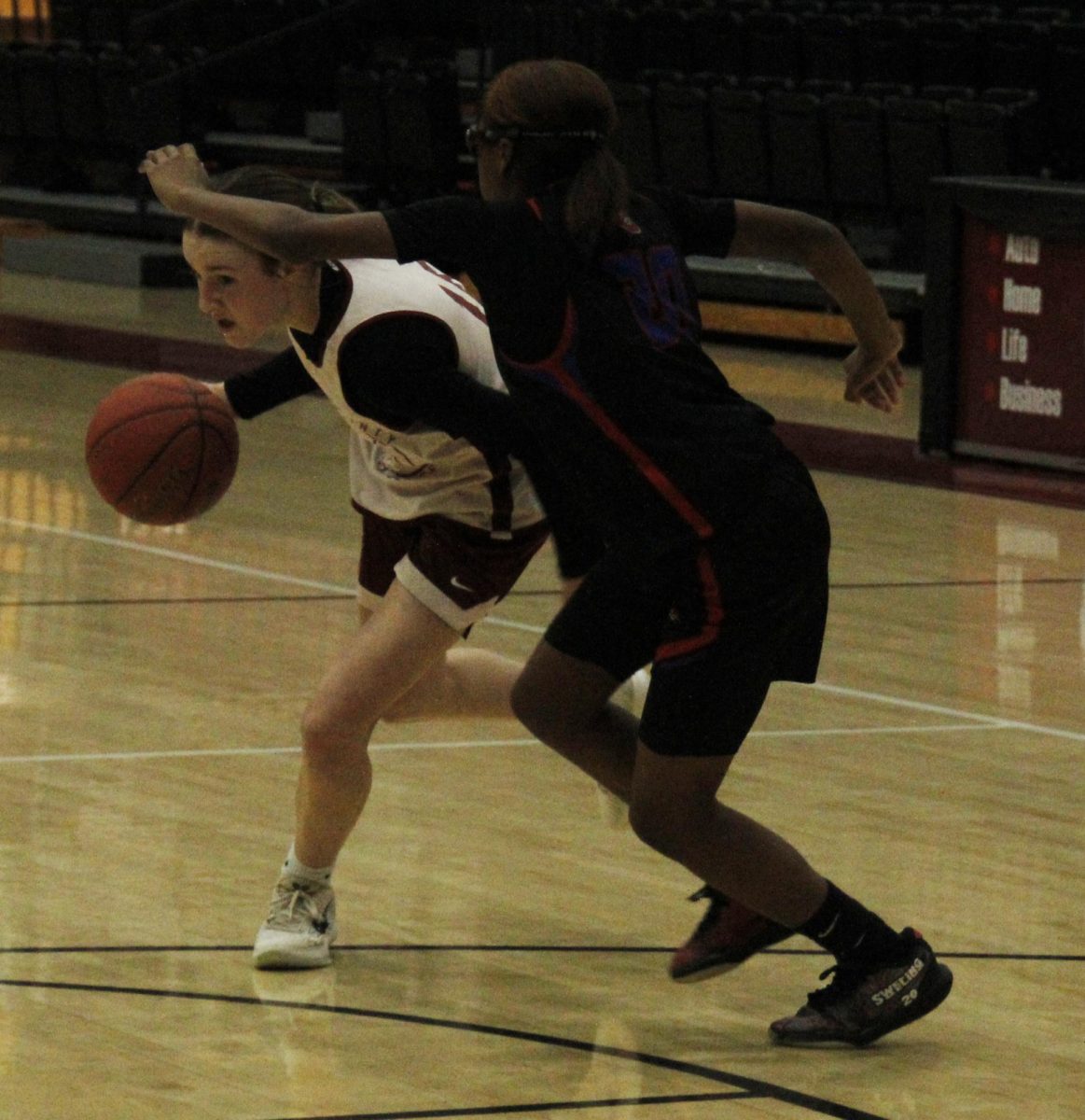 Harlan County freshman guard Jaycee Simpson drove around a Scott County defender in scrimmage action Saturday.