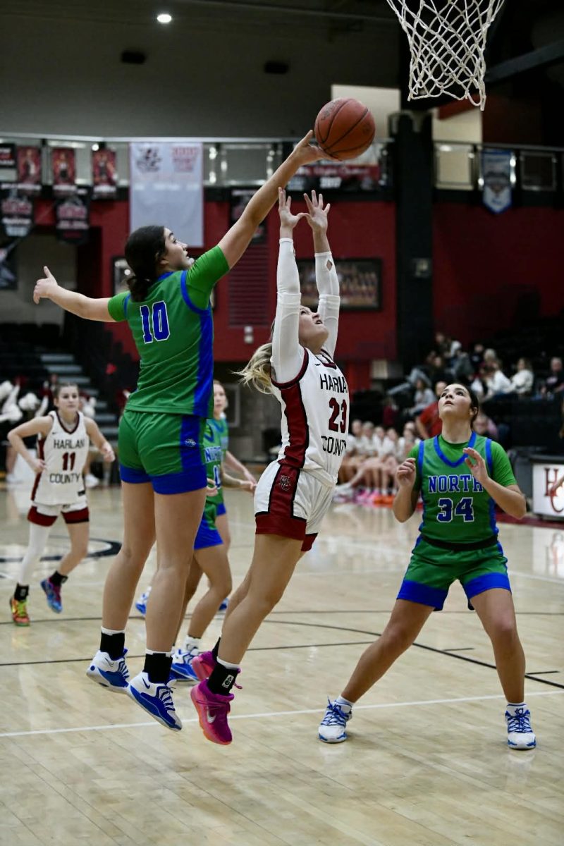 Standout North Laurel center Mariella Claybrook went over Harlan County’s Whitney Noe for a rebound in Tuesday’s game. Claybrook scored 23 points to lead the Lady Jaguars to a 73-43 victory.