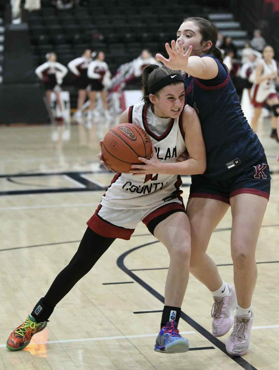 Harlan County guard Reagan Clem worked against Knott Central’s Rylee Craft in Friday’s game. The Lady Bears found the going tough around the basket against the larger Lady Patriots in a 45-42 loss.