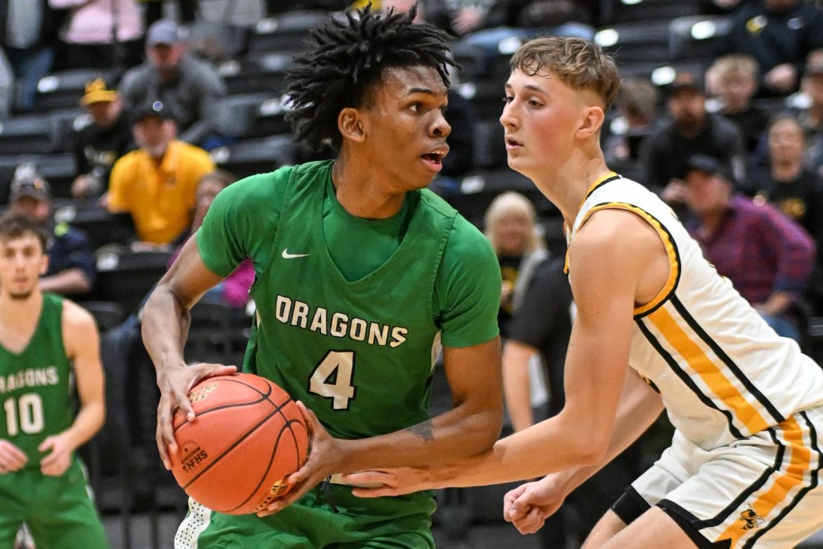 Harlan junior forward Legend Mimes worked against Middlesboro in district action Friday. Mimes finished with 14 points and a team-high nine rebounds in the Dragons' 66-64 win.