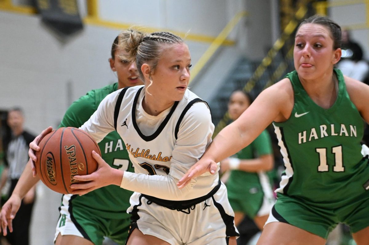 Harlan’s Raegan Goodman (left) and Addison Campbell converged on Middlesboro guard Millie Roberts in Friday’s district clash. Roberts scored 19 points in the Lady Jackets' 64-52 victory.
