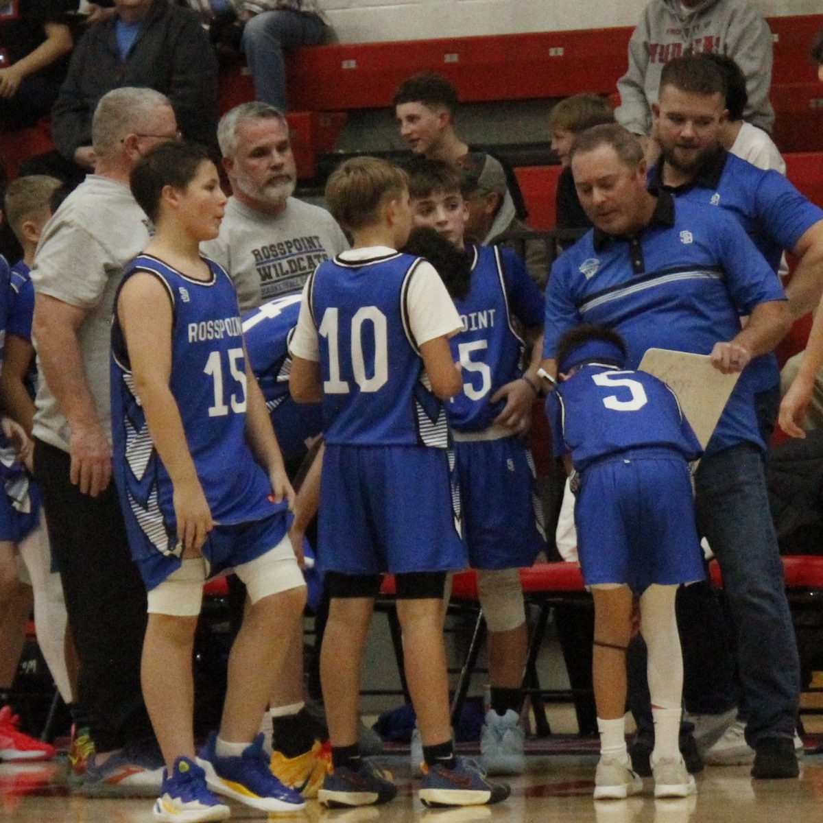 Rosspoint coach Anthony Nolan talked with his team during a game earlier this season. The Wildcats won two of three games Monday at Wallins with the Devils claiming a 49-18 victory in the seventh- and eighth-grade game.