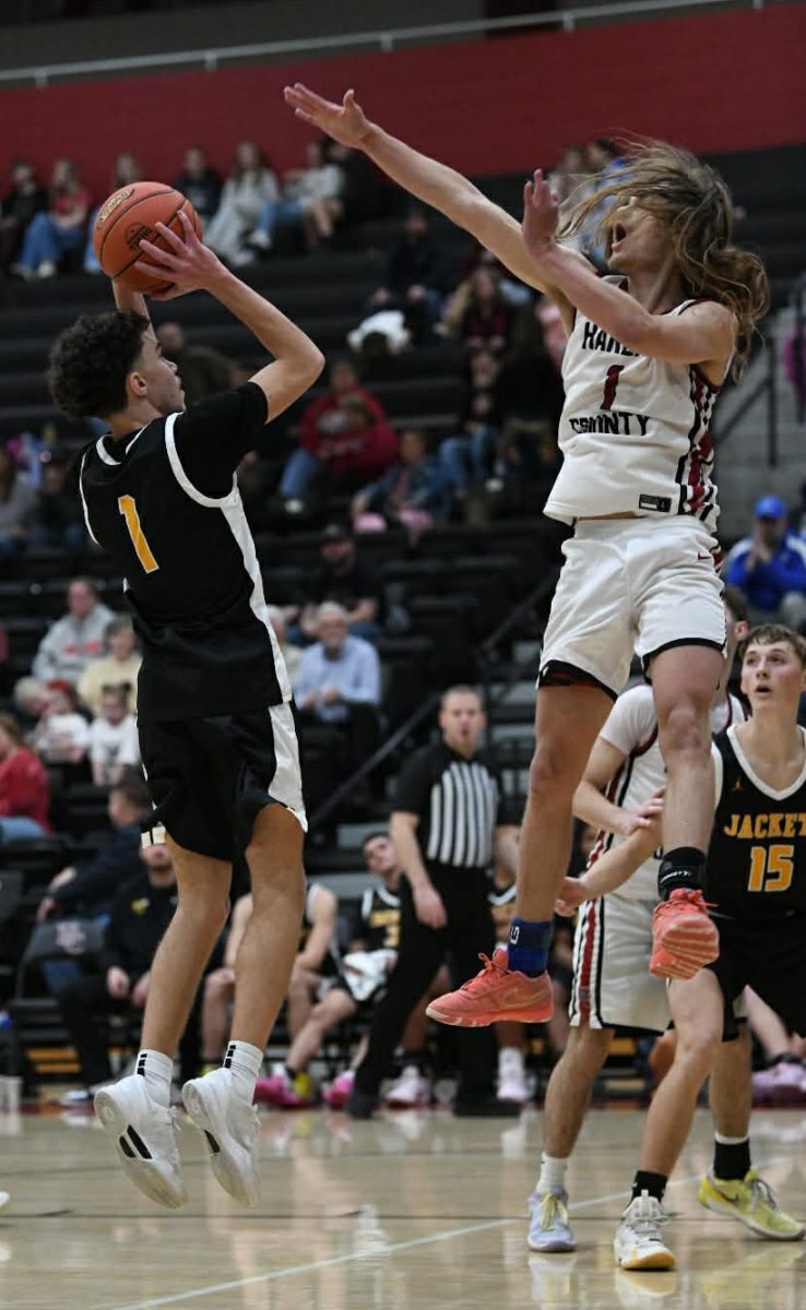 Middlesboro guard Bryson Brooks put up a shot against Reggie Cottrell in Friday's district clash. Cottrell scored 25 points in the Bears' 86-67 win. Brooks scored 15 for the Jackets.