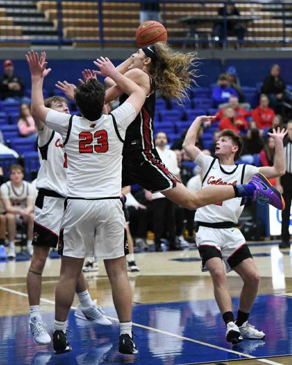 Harlan County guard Reggie Cottrell sailed to the basket for two of his 32 points Saturday in the Bears' 76-69 loss to Whitley County in the 2A Section 7 Tournament at Bell County.