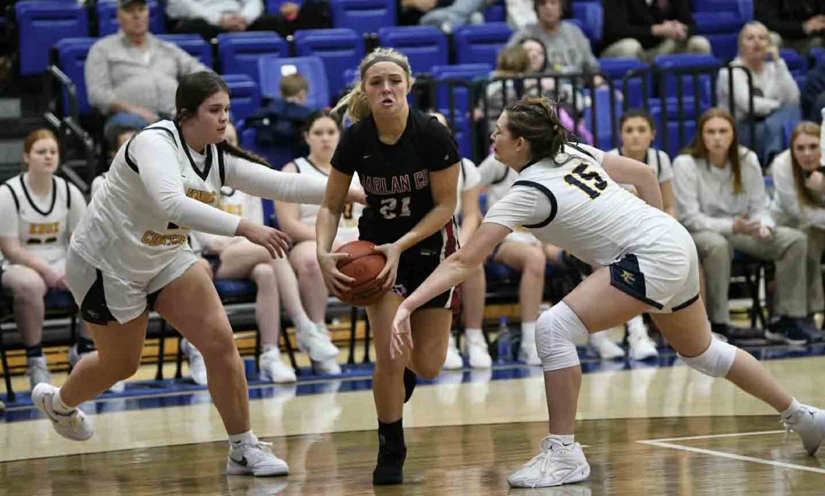 Harlan County eighth grader Taylynn Napier sliced between two Knox Central defenders in 2A Section 7 Tournament action Monday. Napier scored 15 points, pulling Harlan County to within one with just over five minutes left before Knox Central went on an 11-0 run to win 56-45.