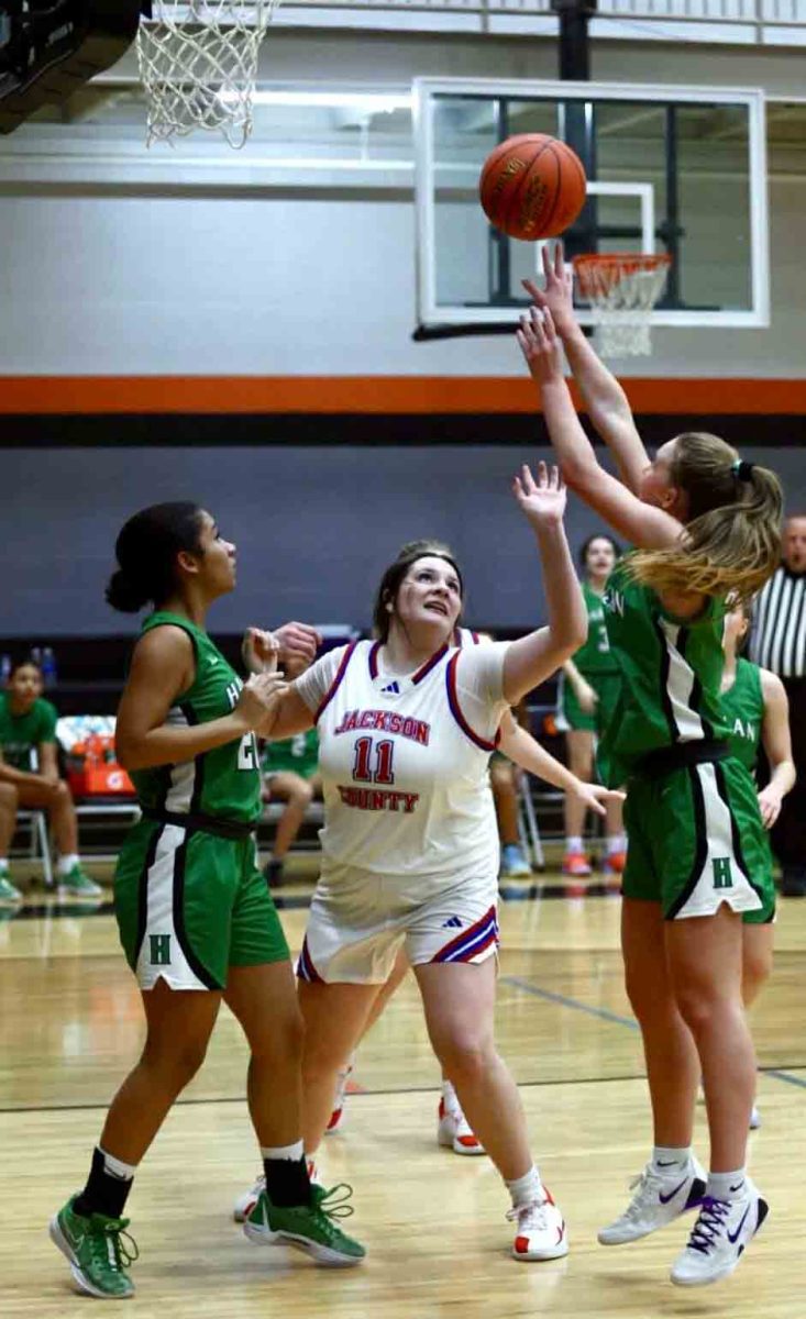 Harlan guard Cheyenne Rhymer put up a shot in Monday's All "A" Classic game against Jackson County. The Lady Dragons fell 56-47 in overtime.