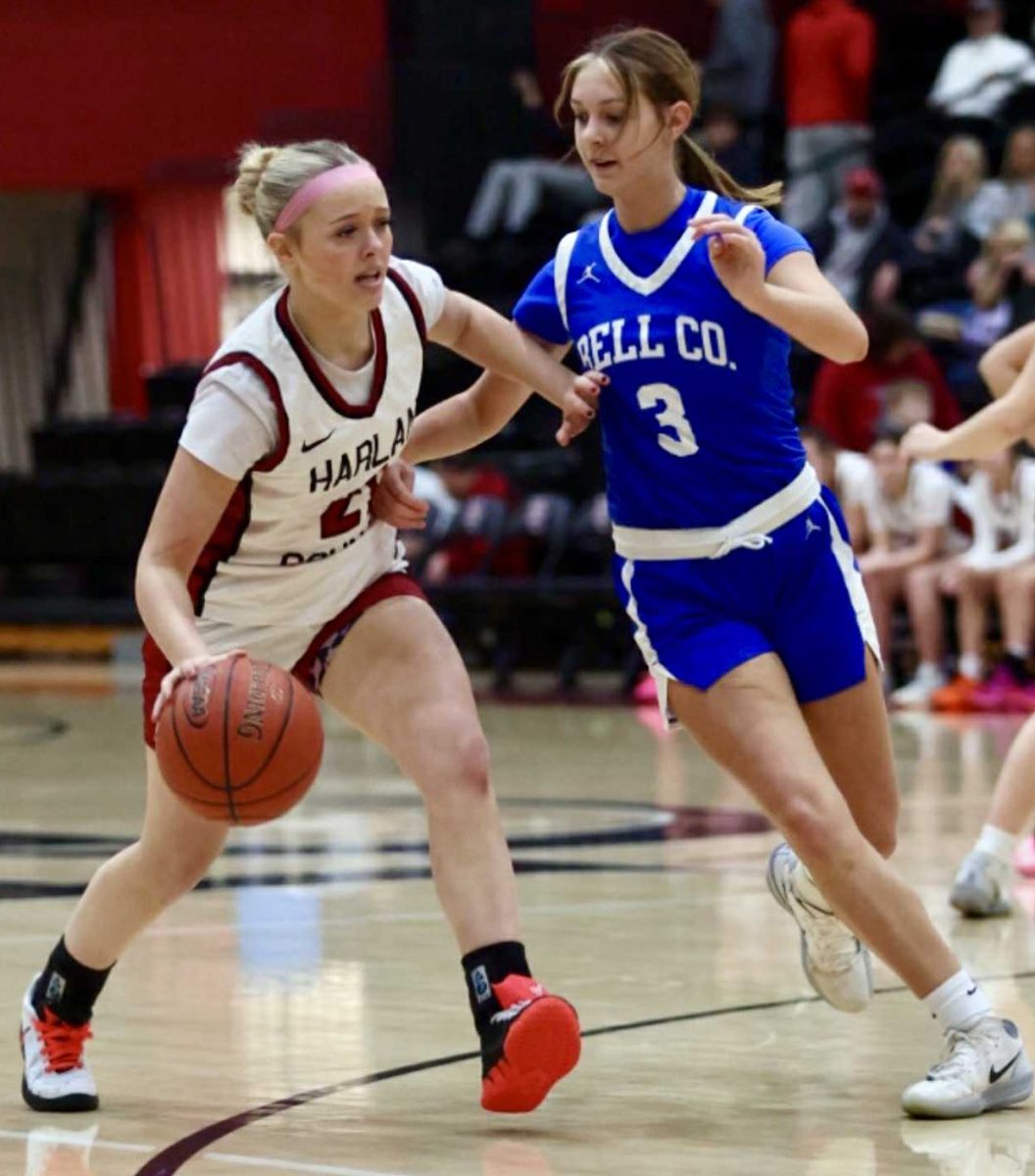 Harlan County guard Taylynn Napier worked against Bell County's Bristal Jordan in Wednesday's district clash.