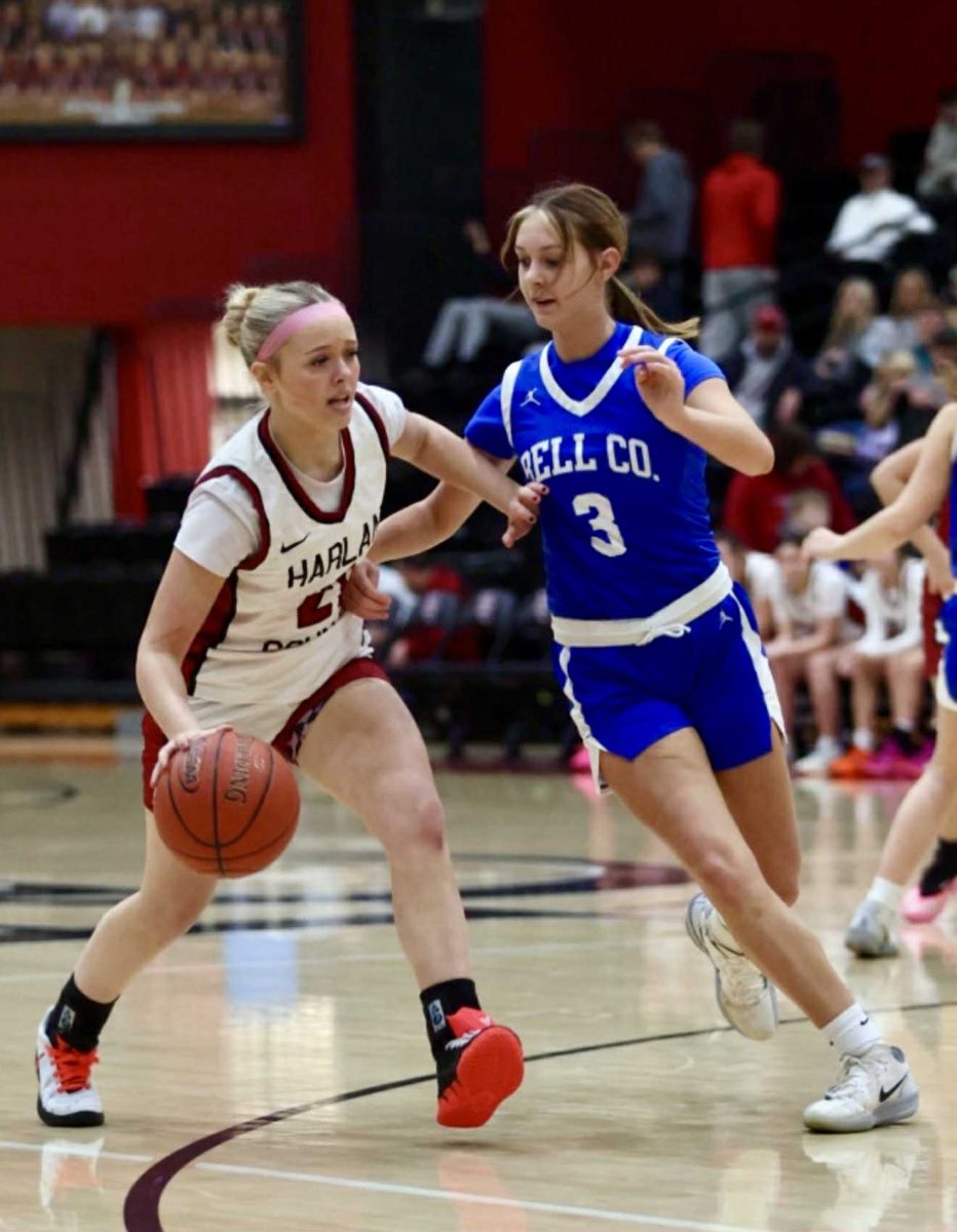 Harlan County guard Taylynn Napier worked against Bell County's Bristal Jordan in Wednesday's district clash.