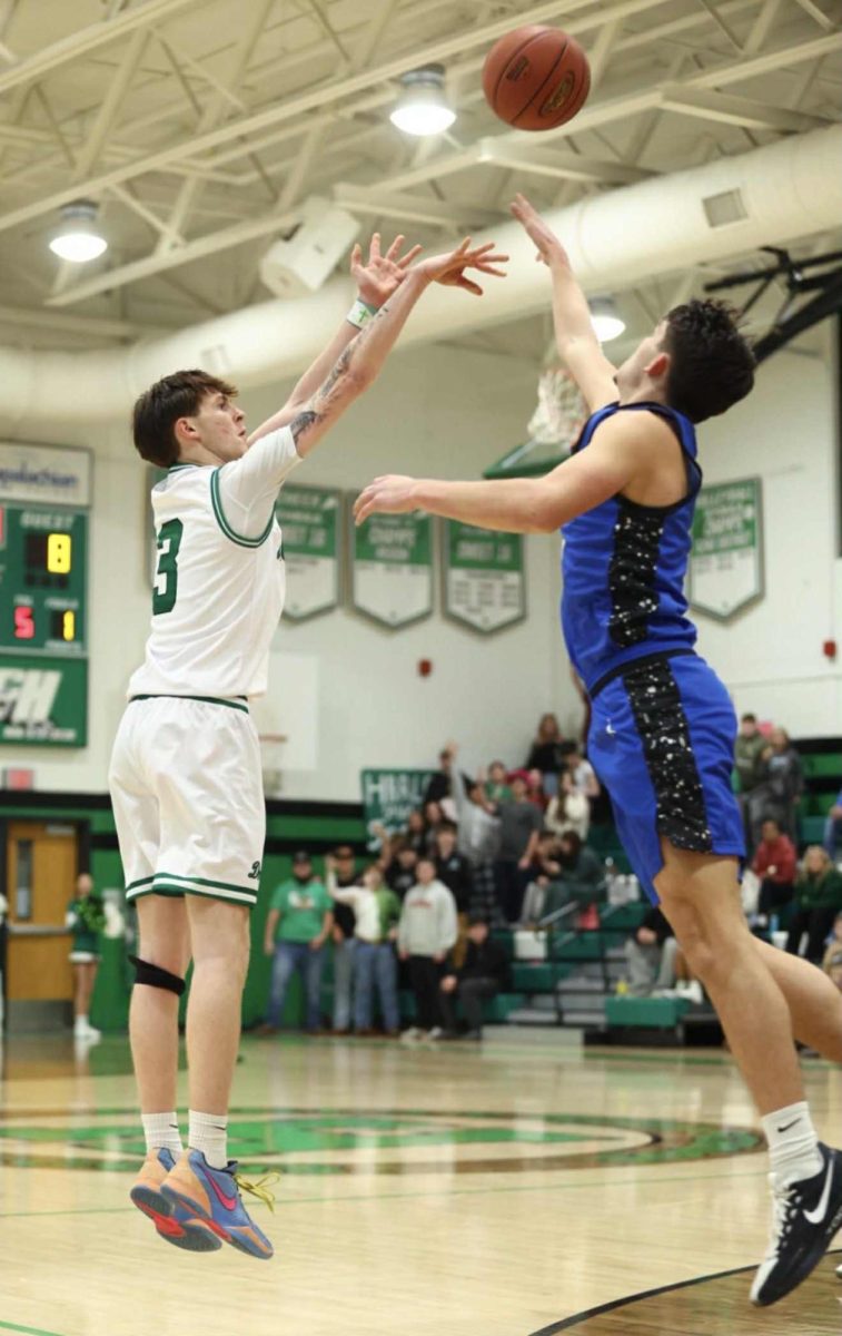 Harlan guard Izack Saylor put up a shot in Tuesday’s game against Bell County. Saylor led the Dragons with 20 points in a 92-56 loss.