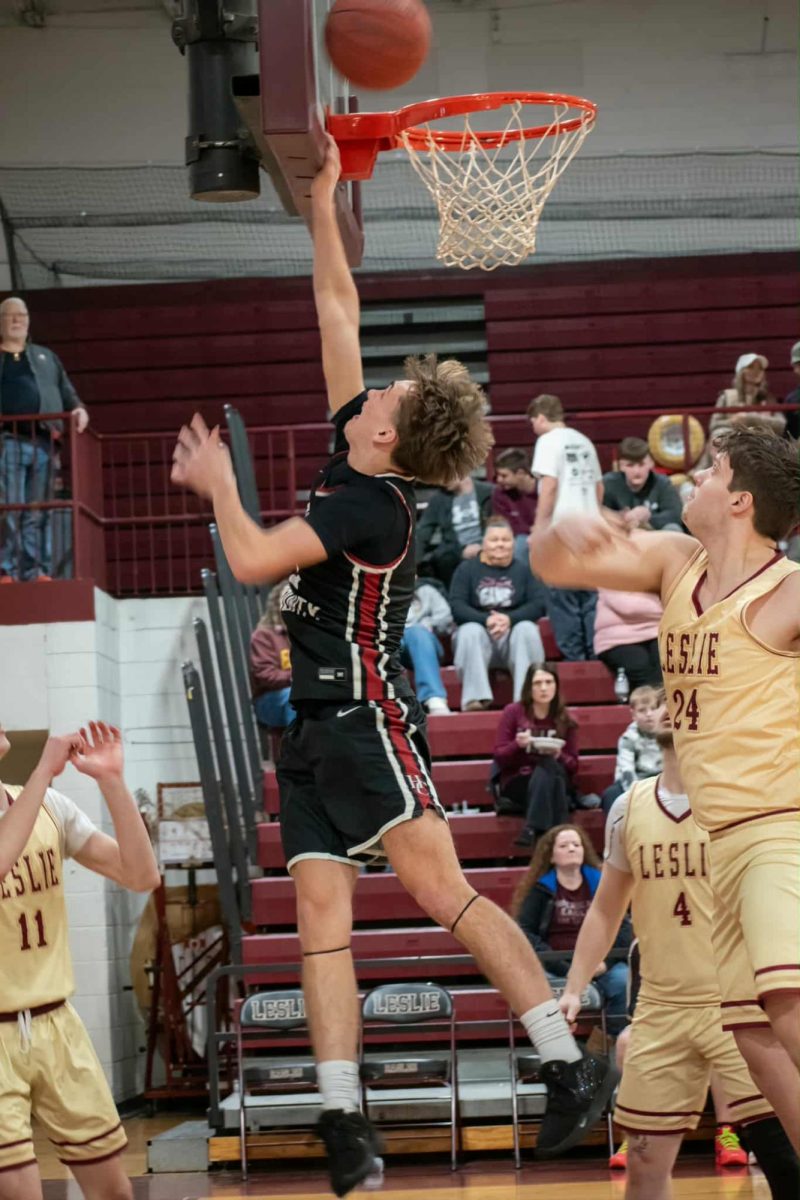 Harlan County senior guard Brennan Blevins sailed to the basket during Monday's game at Leslie County. Blevins scored eight of his 10 points in the fourth quarter as the Bears rallied for a 79-73 victory.